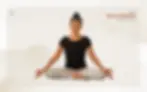Woman practicing Mula Bandha (Root Lock) in yoga Siddhasana Pose