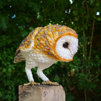 Paper sculpture of a barn owl