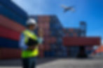 manual-worker-holding-walkie-talkie-while-working-shipping-yard.jpg