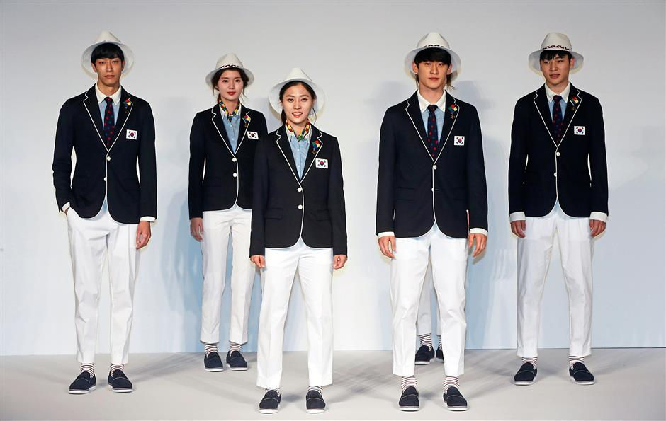 South Korean athletes and models show the country’s Olympics team uniforms. Photo: AFP