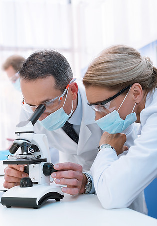 professional-scientists-in-white-coats-and-sterile-2023-11-27-05-01-07-utc.jpg