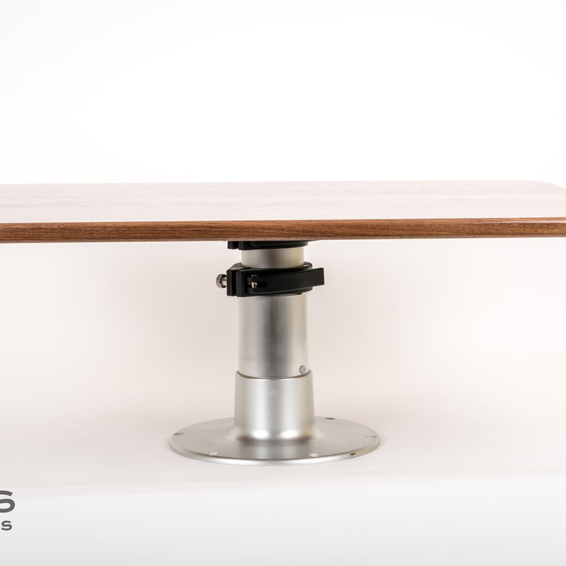 Custom walnut dinette table in an Airstream interior