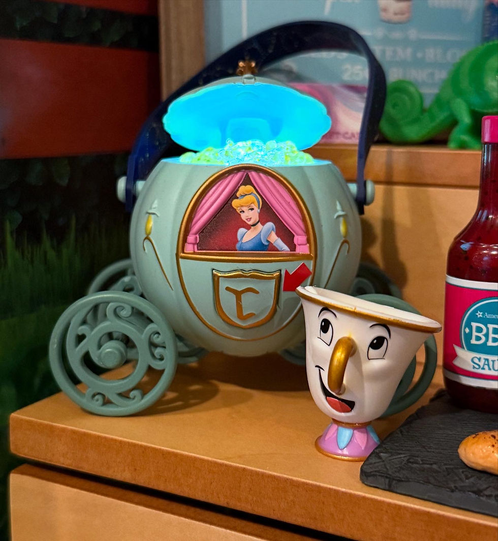 Cinderella popcorn bucket with the lid open, showing the popcorn. The popcorn lights up when you press a button.