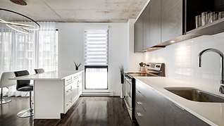Spotless kitchen in a vacation rental, professionally cleaned by Ideal Glow Cleaning Solutions for a quick turnover.