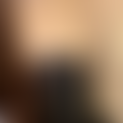 EZ Paint employee sanding walls before painting. Protective material on the floor.