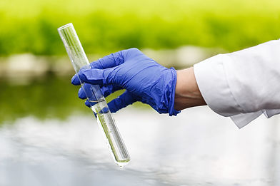 vecteezy_holding-a-water-sample_1486104.jpg