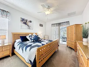 A spacious master bedroom at Cal Cierra , our private pool villa in Emerald Island Resort