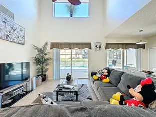 Family lounge with comfortable seating at Leila’s Sunrise, 7 bedroom villa at Emerald Island Resort near Walt Disney World Orlando.Emerald Island Resort villa near Walt Disney World Orlando with modern seating and open living space.