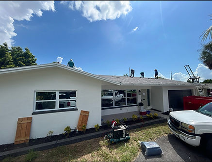 Trusted Bay Roofing workers installing a new roof on a sunny day