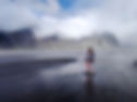 Womam in the balck beach in Iceland