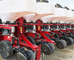 close-up-seeder-attached-tractor-field.jpg