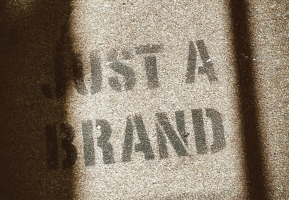 Picture of a fabric that has "JUST A BRAND" on it. This symbolizes the Breakout Group assesses and optimizes brands for small and medium size businesses.