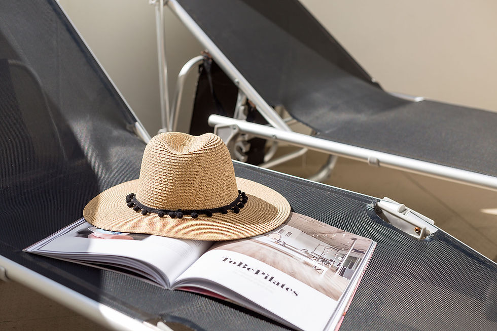 Holidays in Portugal sun lounger and hat by SCH Holiday Homes in Silver Coast Portugal