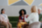 Four women having a casual business meeting
