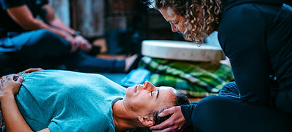breathwork coach running a breathing class.jpg