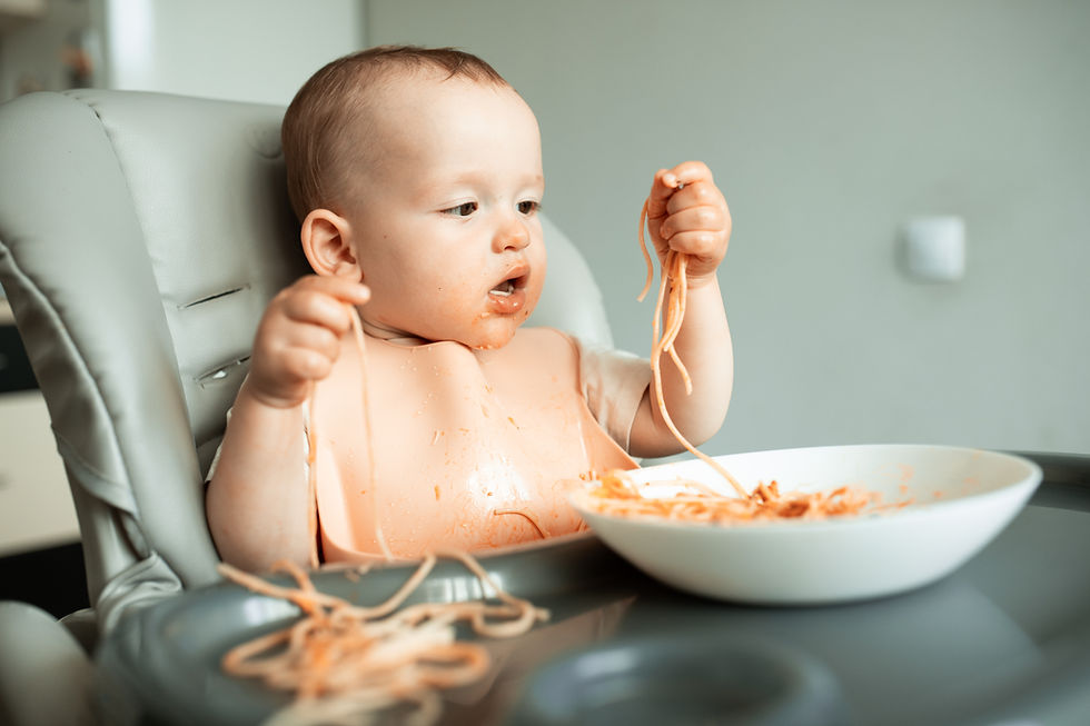 cute-little-boy-eats-spaghetti-with-gusto-and-gets-messy