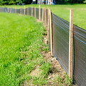 Silt Fence fabric with wooden posts installed prior to the start of construction