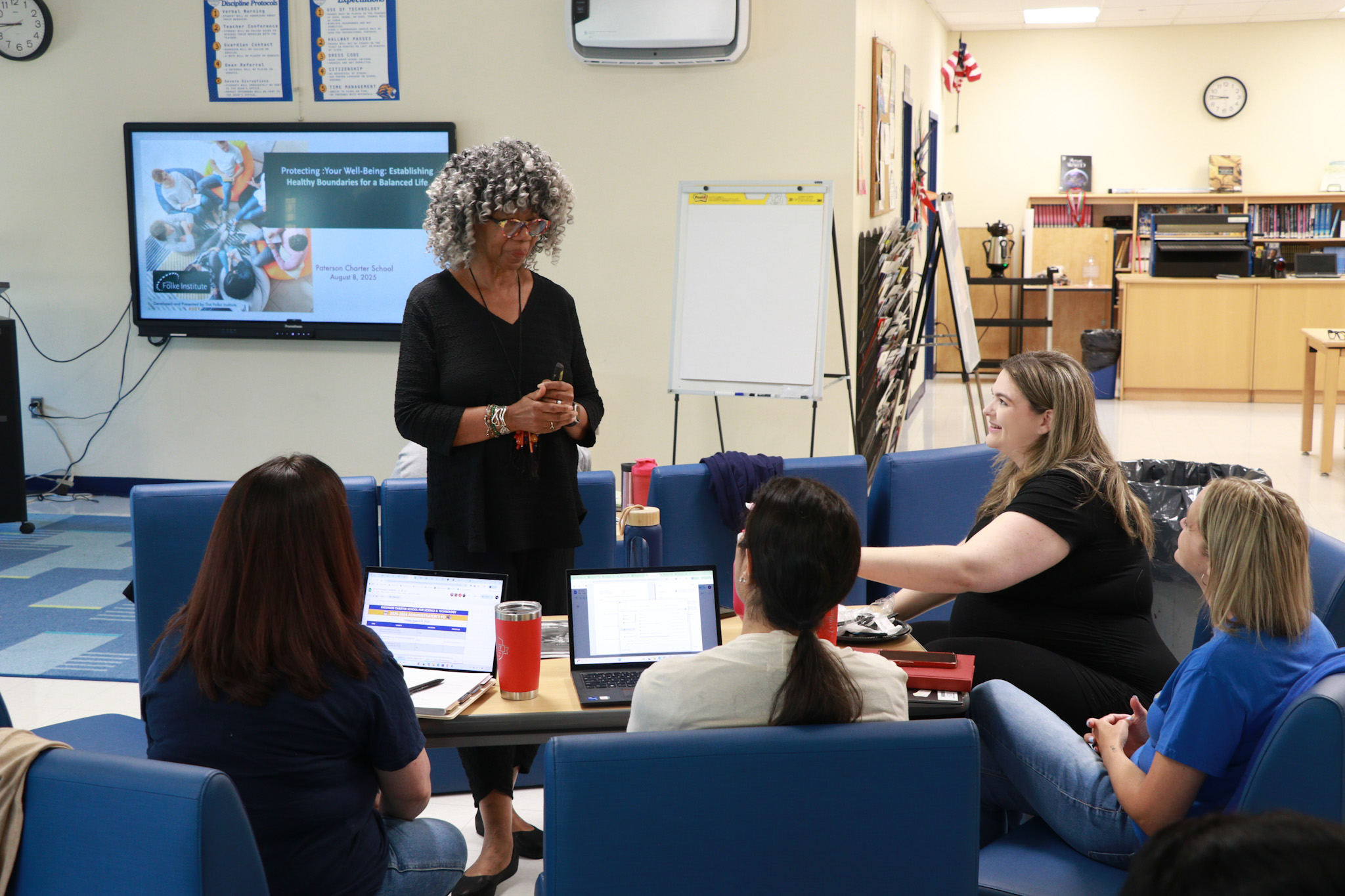 Participants and facilitator in a group learning conversation