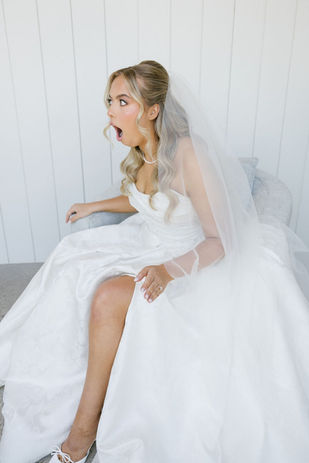 Bride reacting to seeing her custom bridal bouquet for the first time before her Texas wedding.