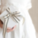 Eye-level view of a beautifully wrapped gift in fabric