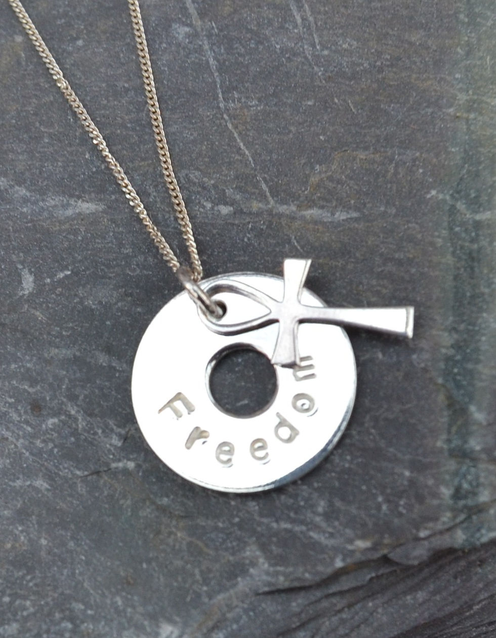 'Freedom' stamped silver washer and cross pendant