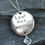 Thumbnail: 'Love one another' and heart stamped disc pendant with cubic zirconia drop