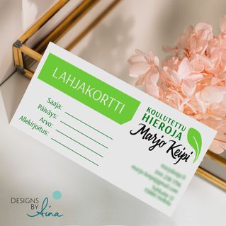 A bright green and white massage business gift card leaning to a metal tray with a flower behind it.