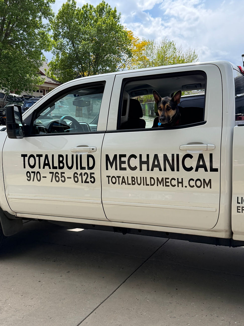 TotalBuild Mechanical Mobile Service Vehicle With Dog, for HVAC calls to High Rockies Homes and Small Commercial Settings. New Construction Options