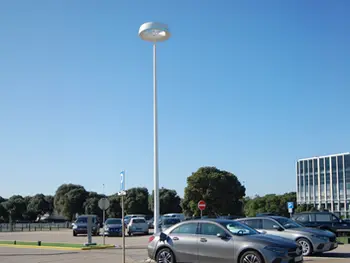 EV charging integrated into smart urban lighting infrastructure in a city parking area
