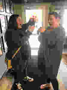 Daughter and mother see their tattoos for the first time.
