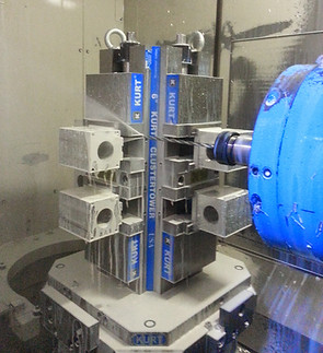 Machine tool with blue and white labels and structure; RUKT, CBI.