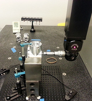 Renishaw CMM probe verifying geometric tolerances on complex aluminum aerospace housing