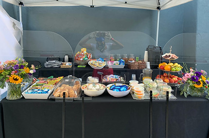 Craft services table with snacks and drinks for film crew in Los Angeles