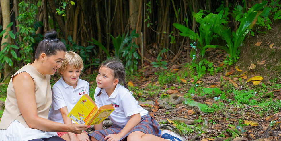 Astor Principal reading with students