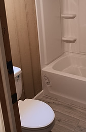 Small bathroom with new tub and toilet installation