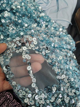 Light blue sequin details on a dress
