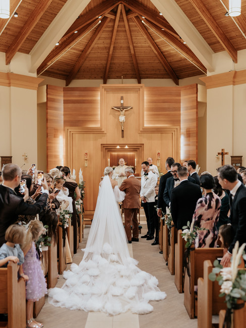 father of the bride giving daughter away during ceremony