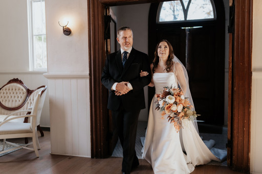Bride and dad walking down the aisle I cranberry Creek Gardens in the chapel