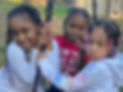 Image of three little girls participating in a St. Luke Legacy Center event, smiling and enjoying the activities.