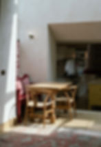 Property photography of dining area in open plan living room and kitchen with tall ceilings and light flooding through