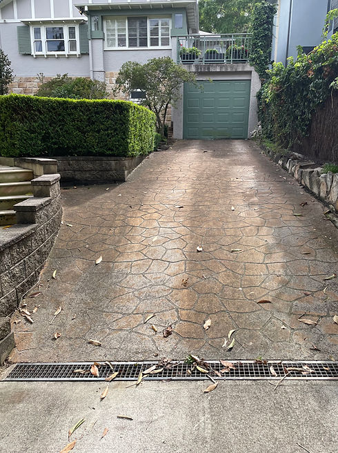 driveway after being pressure washed by St Nick's Exterior Cleaning
