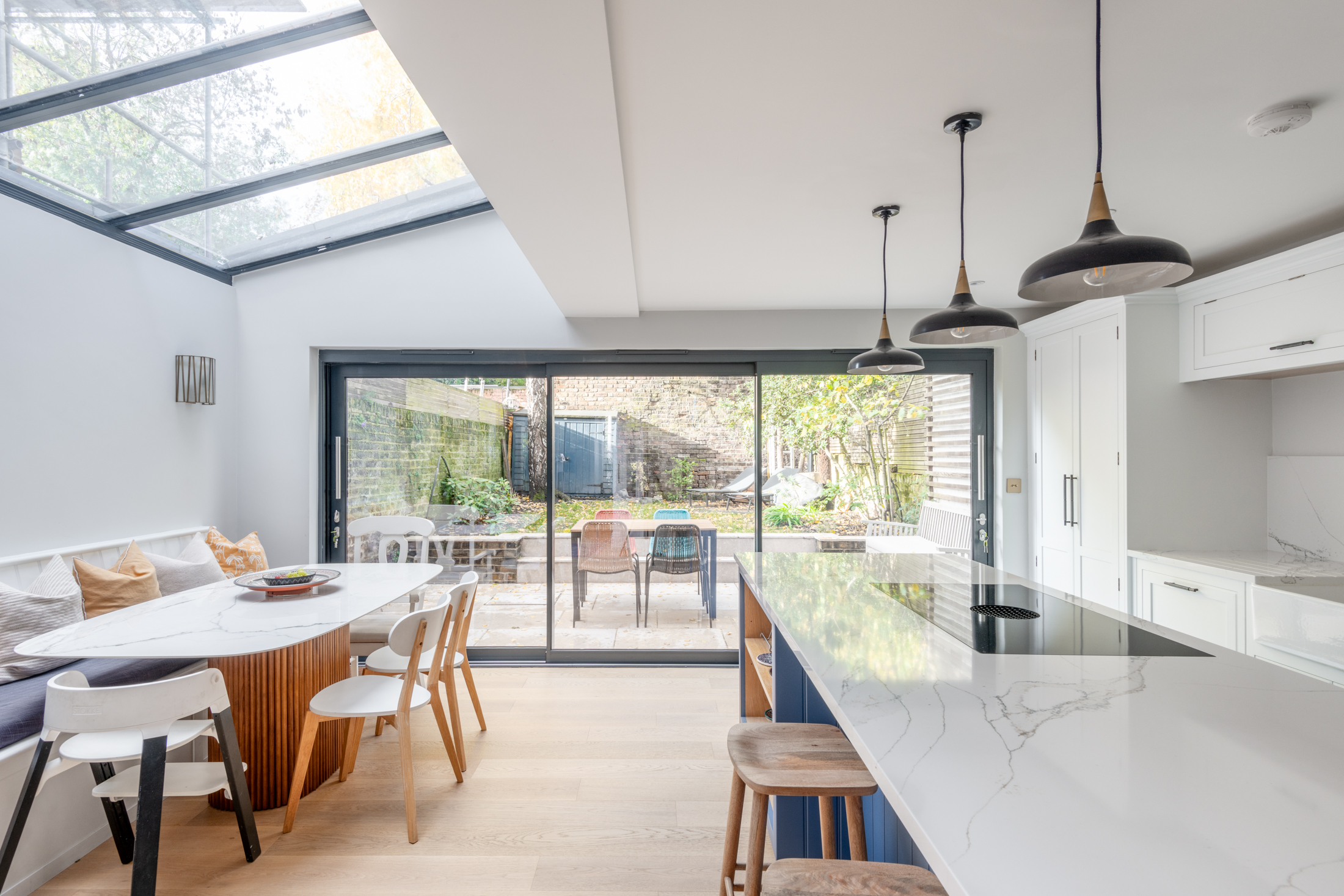 Contemporary kitchen extension with open-plan living area and glazed roof