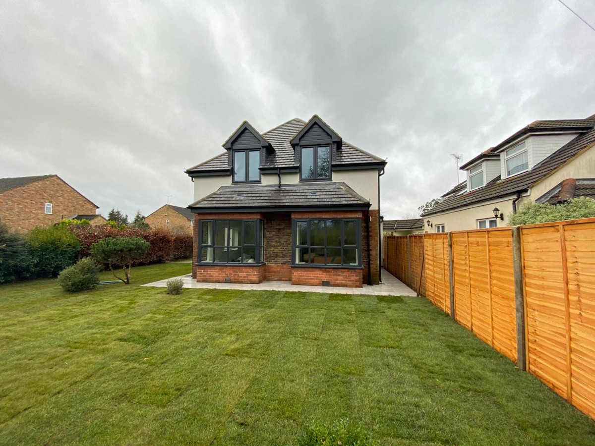 Detached new-build residential house with garden, featured in the Adam Renovations new-build gallery