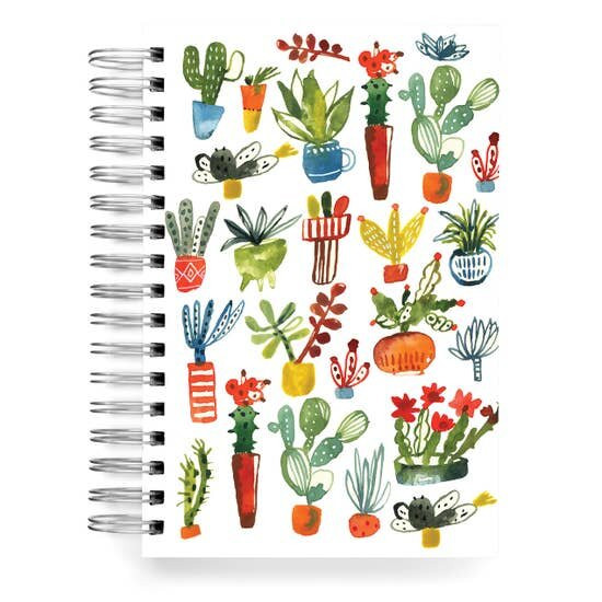Spiral notebook with colourful illustrations of various cacti, plants, and flowers. The notebook is from a sustainable Canadian business in Toronto called Ecojot.