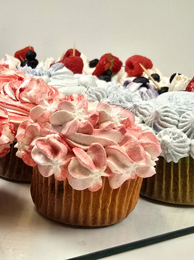 Decorated cupcakes with berries