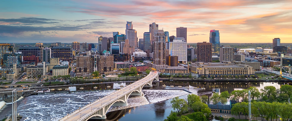 Minneapolis skyline and Stone Arch Bridge at sunset