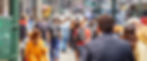 People walking away on a busy urban street