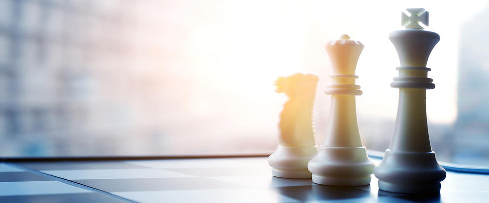 Chess king, queen, and knight on a board