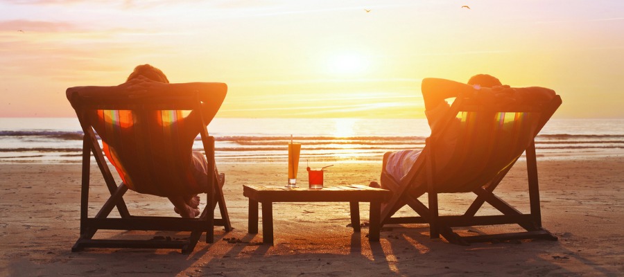 two people on beach chairs