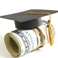 Graduation cap on a roll of US cash for student loans